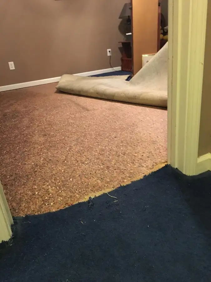 Carpet pad removal revealing water damage during Drying & Dehumidification in Waikoloa Village